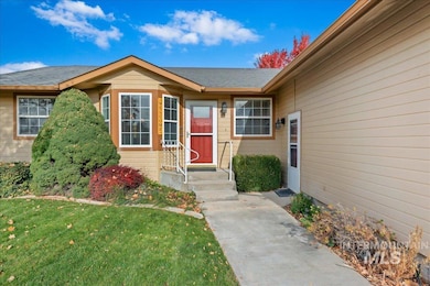 Doorway to property featuring a yard
