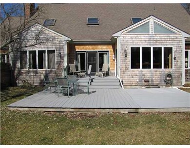Exterior Back. Wooden deck off of dining room and