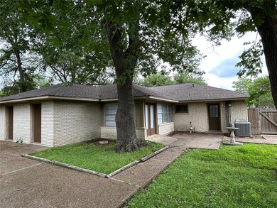 Rear view of house featuring a patio condition unit, and a lawn