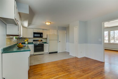 Dining room looking into a freshly painted spacious kitchen
