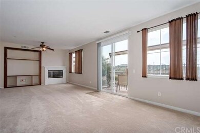 View of the Living room with cozy fireplace, built