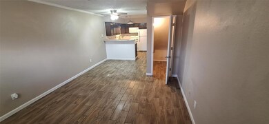 Hallway featuring dark wood-style floors, a textur