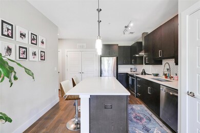 Kitchen with baseboards, a kitchen breakfast bar,