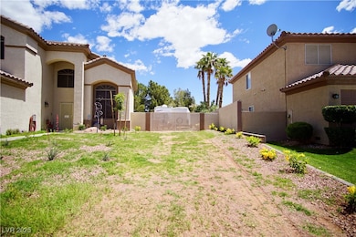 View of yard with fence and a gate