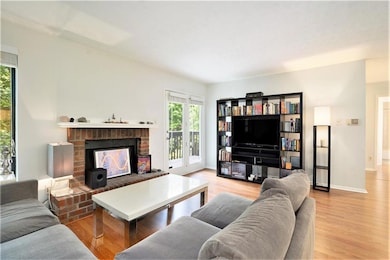 Living room with plenty of natural light, a brick 