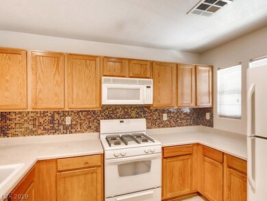 Kitchen with Beautiful Tile Backsplash!