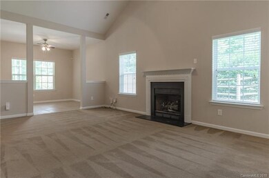 Cozy fireplace in living room, with formal dining 