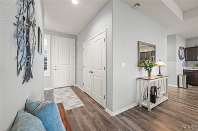 Corridor with dark hardwood / wood-style flooring