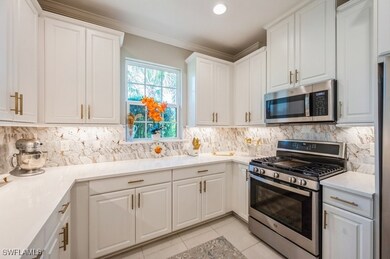 Kitchen featuring stainless steel appliances, whit