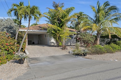 Front of home, covered parking