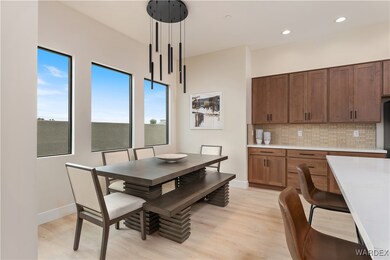Dining area with light hardwood / wood-style floor