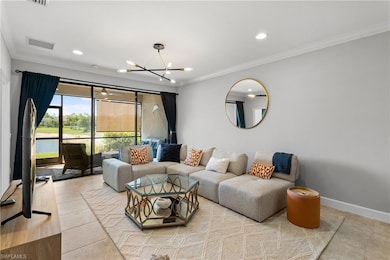 Living area with a chandelier, ornamental molding,