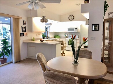 Dining room and kitchen with cathedral ceiling