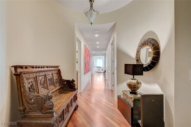 Hall featuring wood finished floors and recessed lighting