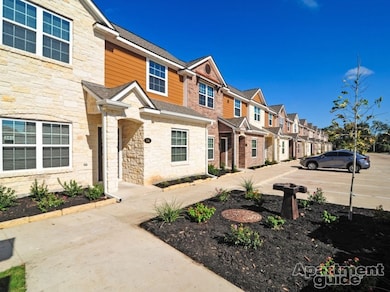 Multi unit property featuring stone siding, a resi