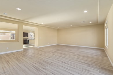 Empty room featuring light wood-style floors and r