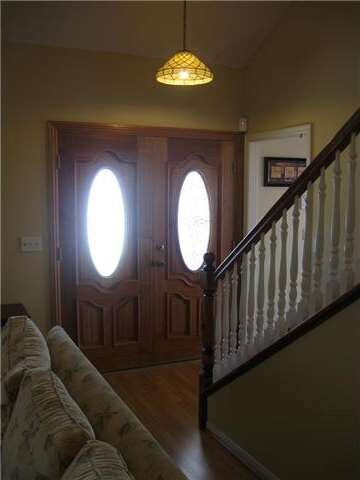 Solid wood double door entry with leaded glass ins