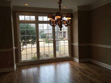 This elegant dining room is completed by the warm 
