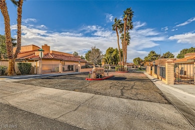View of street with traffic signs, a gate, curbs,