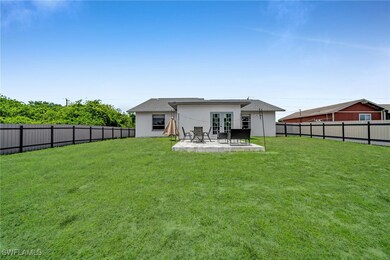 Back of house featuring a patio, stucco siding, a