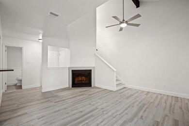 Unfurnished living room with wood finished floors