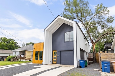 Contemporary home featuring concrete driveway and