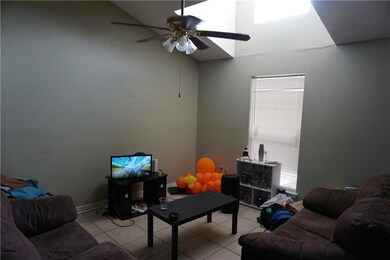 Living Rm has Skylight and ceiling fan