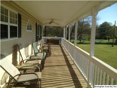 Three sided wrap around porch. Notice the large ga