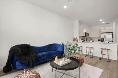 Living area featuring light wood-style flooring a