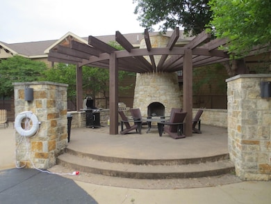 View of patio / terrace with an outdoor stone fire
