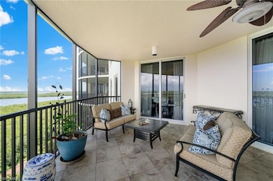 Sunroom / solarium featuring ceiling fan and a wat