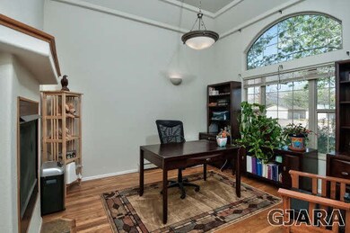 The home's two-sided gas-log fireplace is shard by