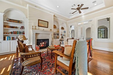 Living room features great built-ins, high ceiling