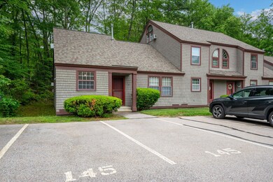 Parking in front of the home, trees on the  side