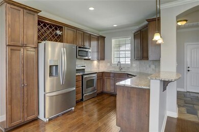 Kitchen featuring appliances with stainless steel