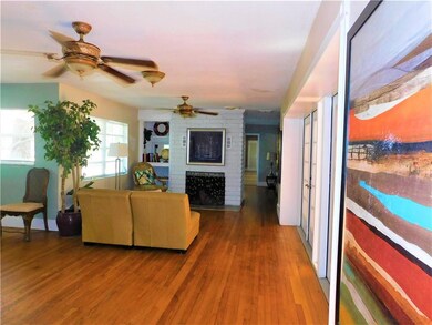 Sitting area with original wood-burning fireplace and built-in niche.