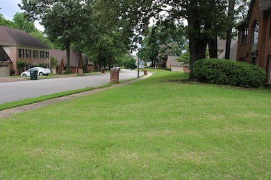 View of grassy yard with a residential view