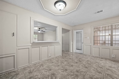 This room features freshly painted walls and tiled