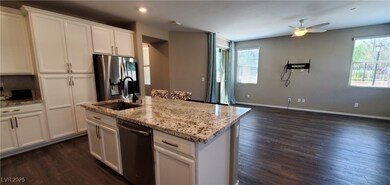 Kitchen featuring stainless steel appliances, a si