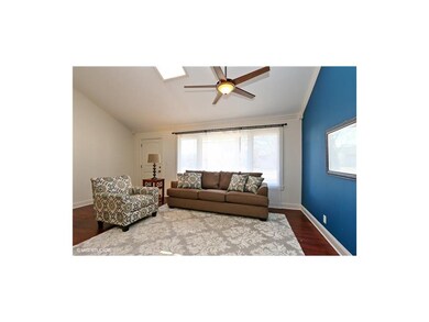Bright, Sunny Room With Newer Ceiling Fan.
