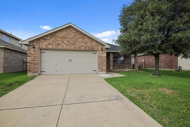A front facing garage makes vehicle accessibility a breeze.