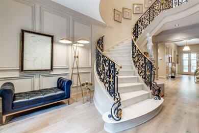 Stairs featuring french doors, crown molding, wood
