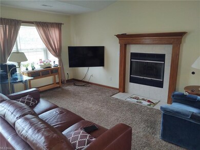 Great room with vaulted ceiling and fireplace