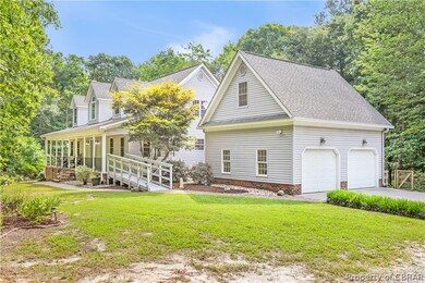 View of front facade with a porch, a garage, and a