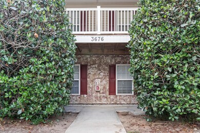 Entrance to property with brick siding