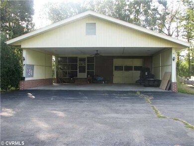 Exterior Front - side view of carport and garage