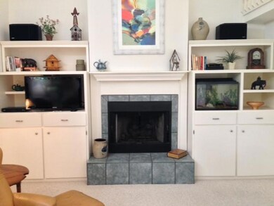 Den/Family/Great Room. Nice and bright with multiple sliding doors overlooking lake area