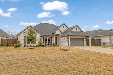 View of front of property featuring a gate, fence,