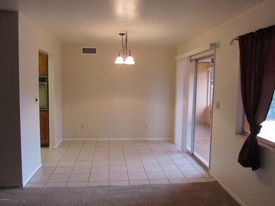 TILED DINING AREA BETWEEN KITCHEN /PATIO