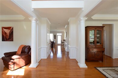 Living room and dining room open onto 2 story foye